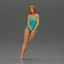woman in a turquoise swimsuit striking a pose - Only-Games