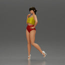 Striking a flirty pose wearing yellow crop top red bottoms - Only-Games
