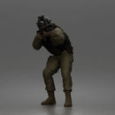 Tactical Soldier Aiming Steadily Wearing Combat Gear And Protective Helmet