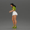 woman standing with a green top white skirt looking like they want to hold something - Only-Games
