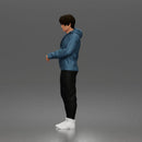 Casual Young Man Standing Relaxed in Hoodie, Joggers, and Sneakers