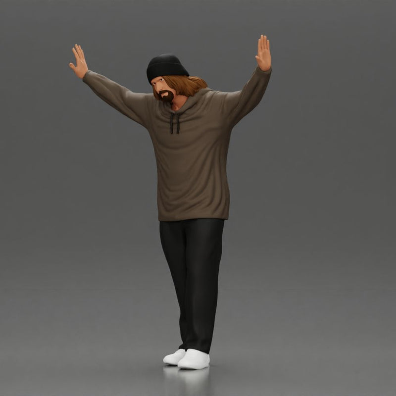Man wearing hoodie and beanie raises hands looking happy in relaxed stance - Only-Games