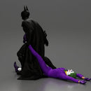 Batman dragging Joker by leg after defeating him in battle - Only-Games