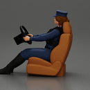 Focused officer in blue uniform driving seated holding steering wheel - Only-Games