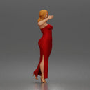 Elegant woman in sleeveless evening dress with side slit