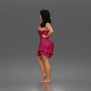 woman posing with hands on hips wearing ruffled dress