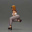 Stylish woman striking a bold pose in modern chic attire and sunglasses - Only-Games