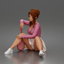 Relaxed Tennis Player Resting Confidently in Sporty Skirt and Sweater