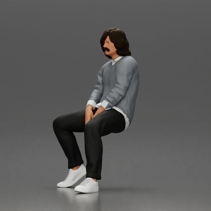 Man in Casual Sweater and Sneakers Sitting with Relaxed Posture - Only-Games