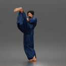 Man Performing Martial Arts High Kick Pose Gi Uniform Belt Barefoot Outfit