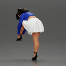 Young woman in skirt adjusts her elegant black high heeled shoes - Only-Games