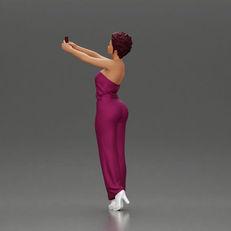 Fashionable woman in a jumpsuit snapping a selfie in style - Only-Games