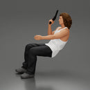 Man sitting with gun in hand pointing forward calmly - Only-Games