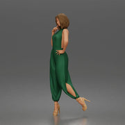 Woman poses thoughtfully lifting heel wearing halter jumpsuit with platform heels - Only-Games