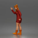 Cheerful Girl Waving Confidently in Stylish Dress and Boots