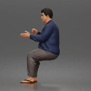 Asian Man sits gesturing while wearing casual sweater pants flip flops comfortably - Only-Games