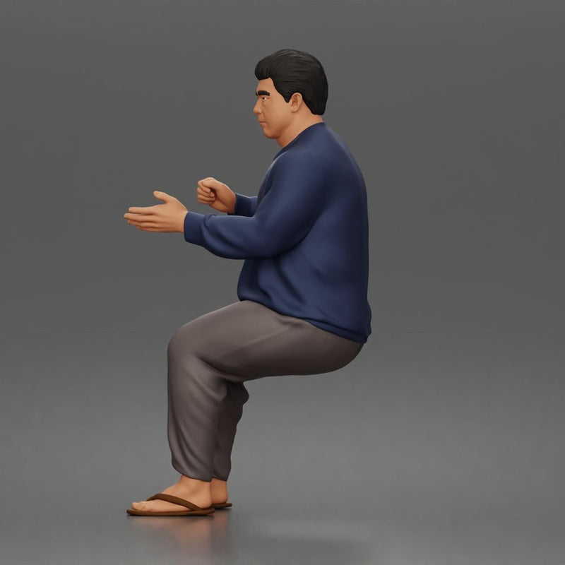 Asian Man sits gesturing while wearing casual sweater pants flip flops comfortably - Only-Games