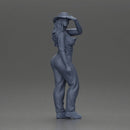 woman in red pants striking stylish pose with hat - Only-Games