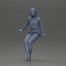 Stylish woman sitting casually in a white top and blue skirt - Only-Games