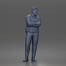 Man Standing Calmly in Casual Cardigan and Dress Pants