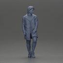 Man in brown coat glances sideways dressed in stylish winterwear - Only-Games