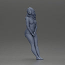 Woman in yellow top and red shorts leaning to wall - Only-Games