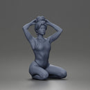 Kneeling Hands On Head Poser in Bodysuit and Hoop Earrings
