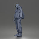 Chill Hooded Cap Walker Posing with Backpack Pants and Sneakers