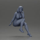 Confident Blonde Woman Sitting Gracefully in Red and Pink - Only-Games