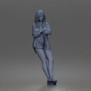 leaning woman folds arms open shirt swimwear bottoms and sneakers