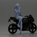 Confident woman sitting gracefully on a sleek modern sportbike - Only-Games