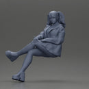 Stylish Woman in Blue Jacket Relaxing with Confident Poise - Only-Games