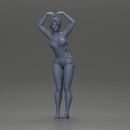 Brunette woman in turquoise swimsuit stretching with elegant ballet pose - Only-Games