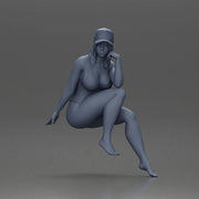 Woman in Swimsuit and Cap Sitting Thoughtfully in Relaxed Pose - Only-Games