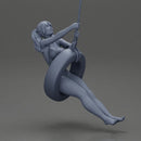 Sexy Girl in onepiece Enjoying a Fun Swinging Adventure on Tire - Only-Games