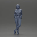 Confident woman leaning slightly with her hands in pockets - Only-Games