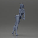 woman in a turquoise swimsuit striking a pose - Only-Games