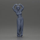 Confident woman striking a heart-shaped pose with joyful energy - Only-Games