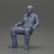 Muscular Bearded Man in Beanie Vest Pants Sitting Casually Relaxed - Only-Games