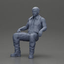 Muscular Bearded Man in Beanie Vest Pants Sitting Casually Relaxed - Only-Games