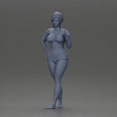 woman posing barefoot wearing bikini top and shorts stylishly - Only-Games