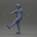 Woman in casual outfit joyfully kicks her leg with energy - Only-Games