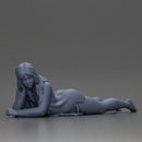 Girl with long hair in green dress lying with calm on the beach - Only-Games