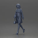 Woman with curly hair wearing red coat walking holding red handbag - Only-Games