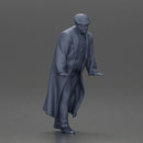 Man in black coat wearing flat cap standing with serious expression - Only-Games