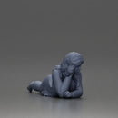 Girl with long hair in green dress lying with calm on the beach - Only-Games