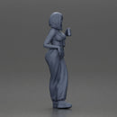 Woman with black hair wearing blue overalls holding a drink - Only-Games