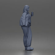 hijabi woman sipping takeaway drink in modern casual streetwear style - Only-Games