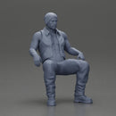 Muscular Bearded Man in Beanie Vest Pants Sitting Casually Relaxed - Only-Games