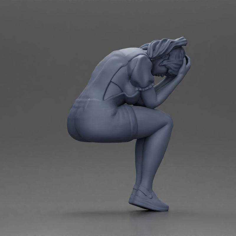Crying girl sitting low in orange dress with head in hands - Only-Games
